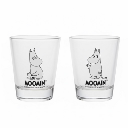 Two clear glasses with Moomin character design on a light surface.